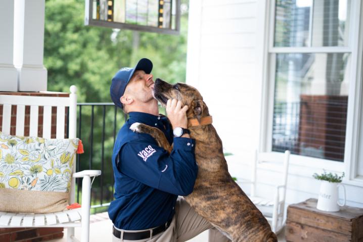 schedule-your-free-inspection image VACO Pest technician with dog